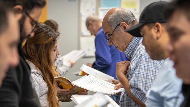 Johnson County Adult Education students working with instructors