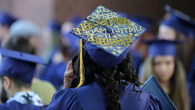 Decorated graduation cap that says, "It seemed impossible until I made it possible"